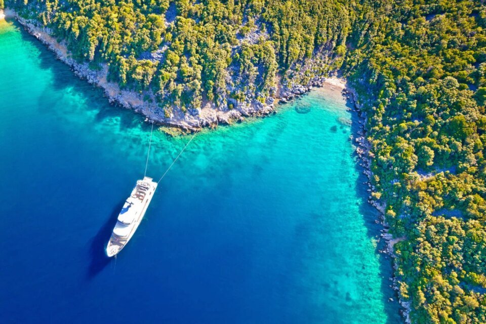 Aerial view of yacht on vibrant blue waters of Losinj, Croatia