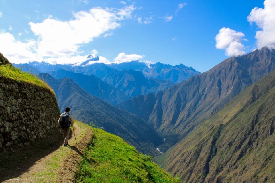 Traveler walking the Inca Trail in Peru on a sunny day